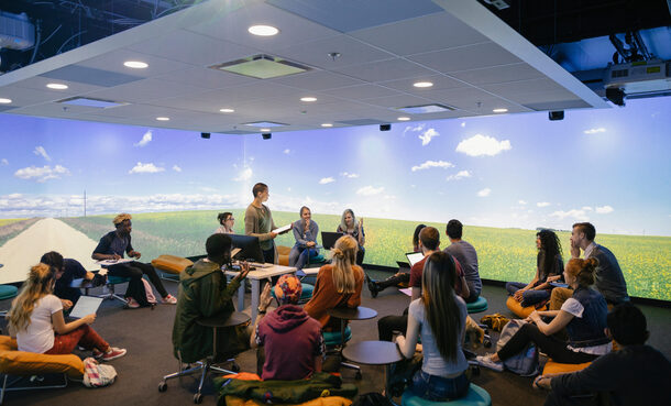 University students in VR classroom with lecturer
