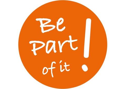 Ein Orangener Kreis mit der weißen Aufschrift: Be part of it!