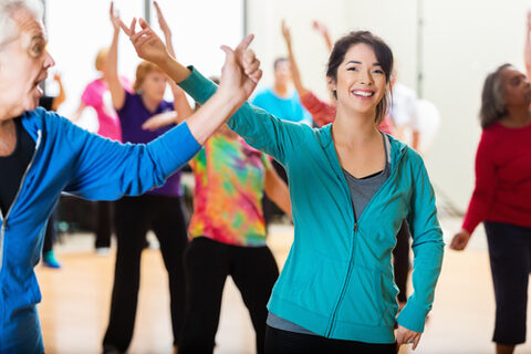 Group of people dancing in exercise class