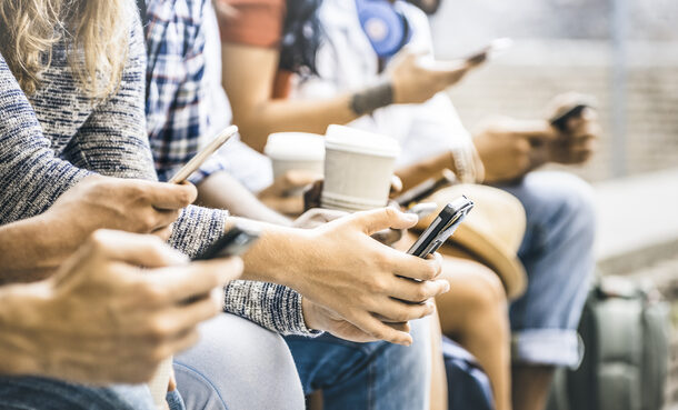 Multicultural friends group using smartphone with coffee at university college break - People hands addicted by mobile smart phone - Technology concept with connected trendy millennials - Filter image